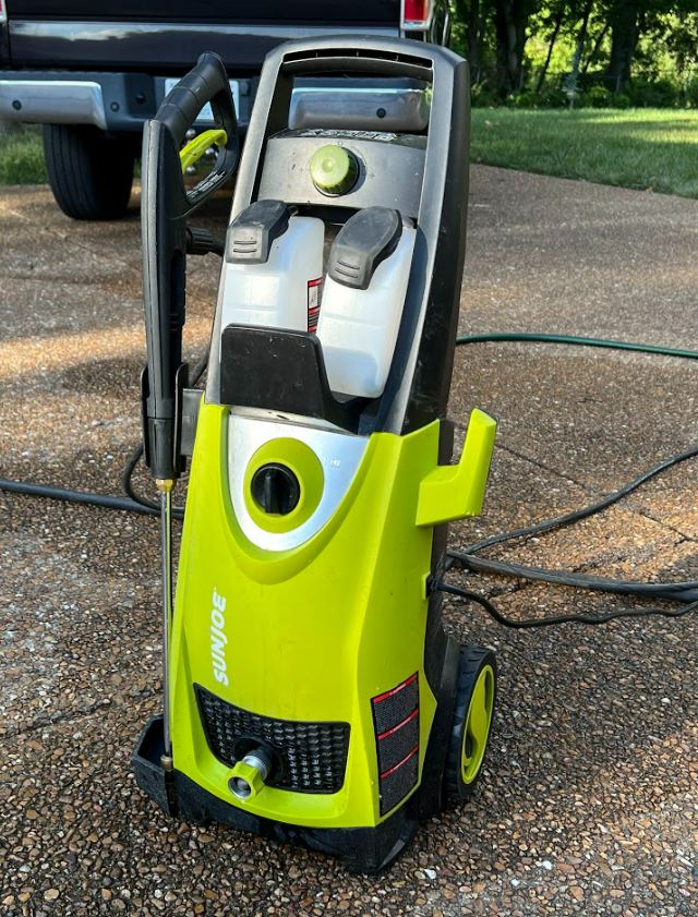 SPX 3000 sun joe electric pressure washer in driveway