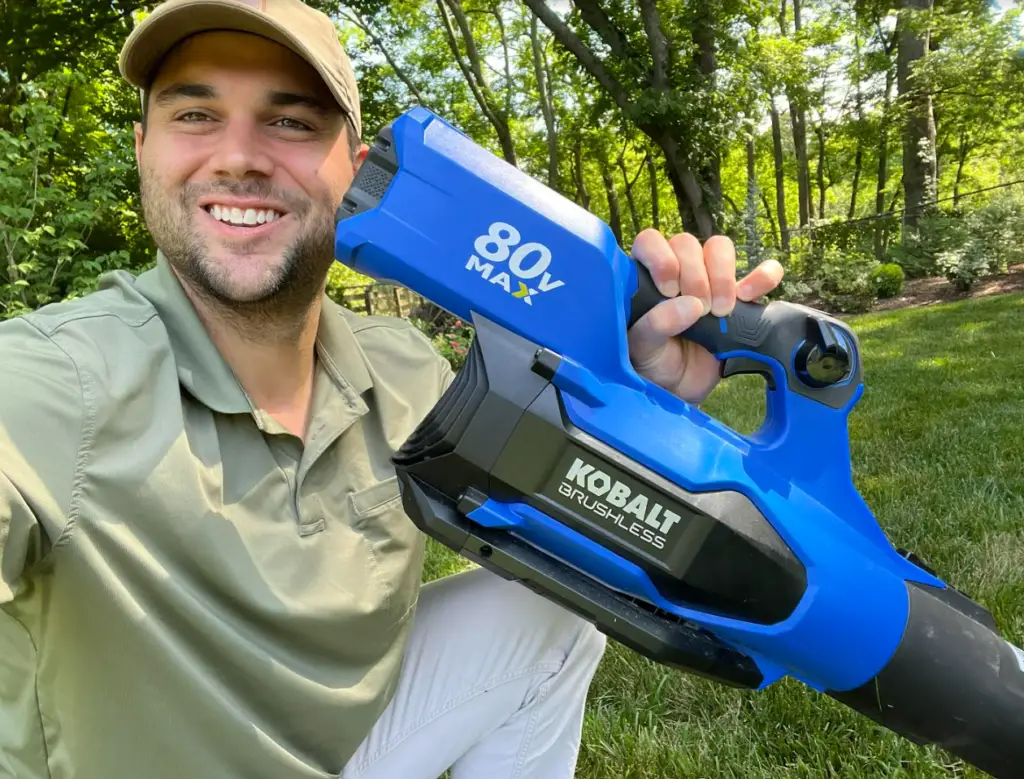 me holding up the Kobalt 80v Max blower in my backyard