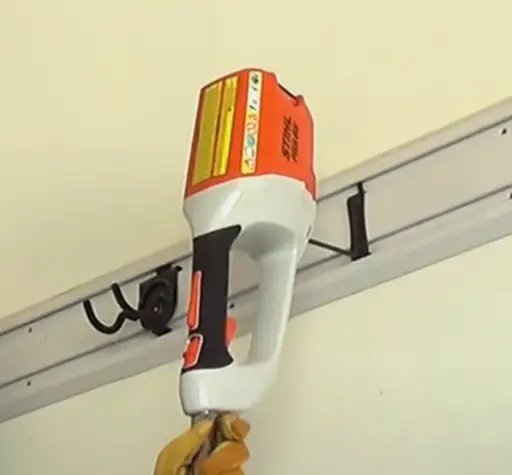 stihl fsa 90 r string  trimmer hanging on a  wall