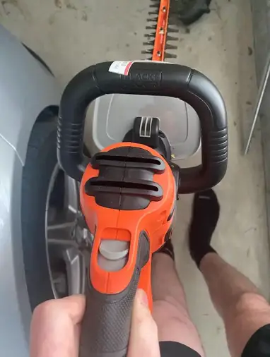 https://thelawnreview.com/wp-content/uploads/2023/06/Black-and-decker-hedge-trimmer-2.jpg?ezimgfmt=rs:382x507/rscb1/ng:webp/ngcb1