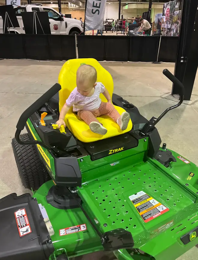 daughter on riding mower