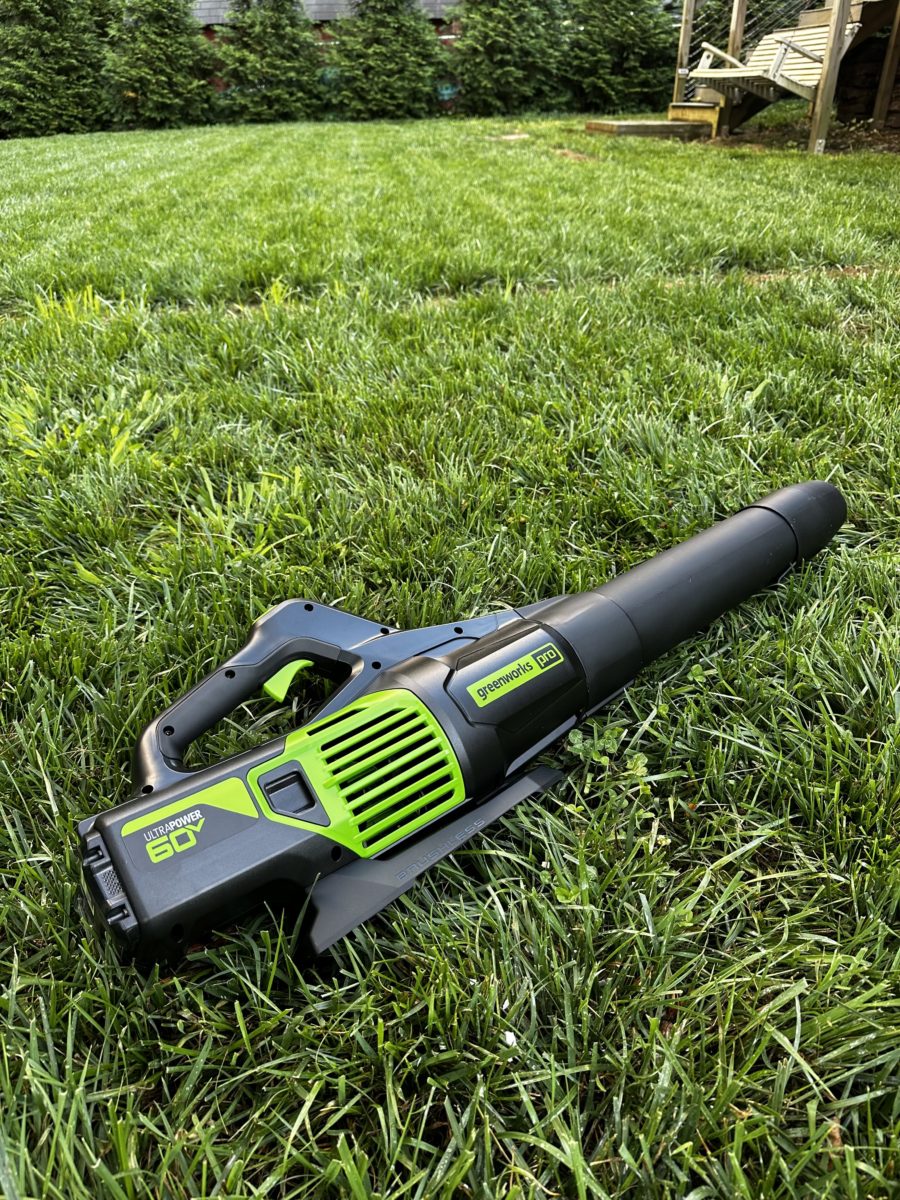 Greenworks 60V 610 CFM blower lying  in grass
